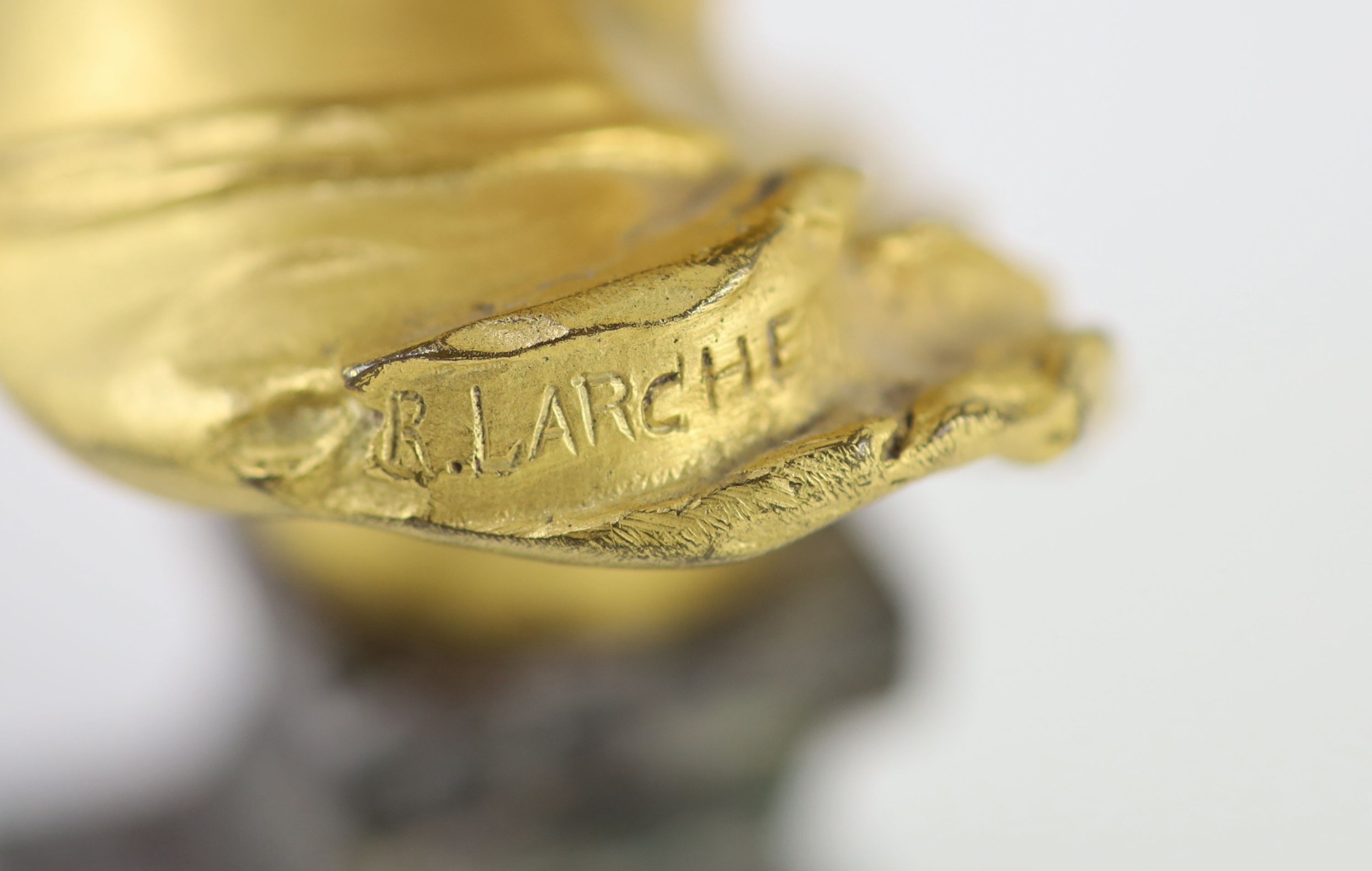 Raoul Francois Larche (1860 - 1912). An ormolu head of a boy king, 16.5cm high overall